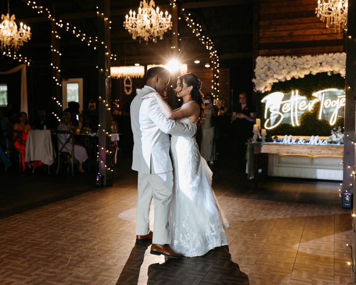 Wedding guests dancing around the couple